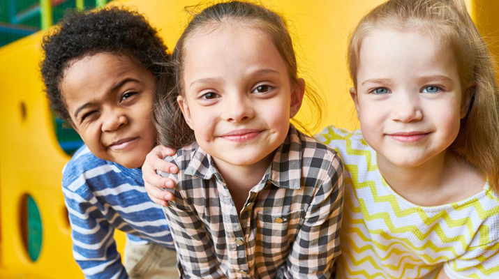 image of a group of diverse young children smiling